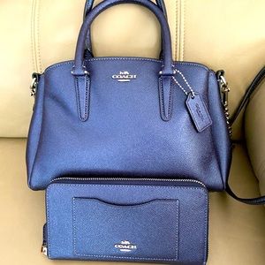 Metallic blue crossbody Coach bag with matching wallet.